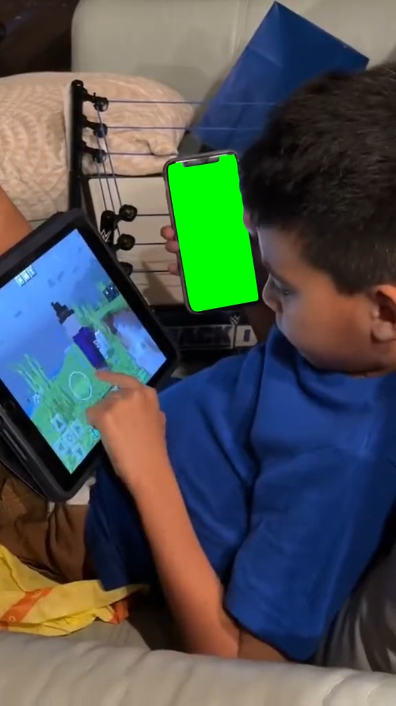 Kid using iPad and iPhone at the same time - iPhone only (Green Screen)