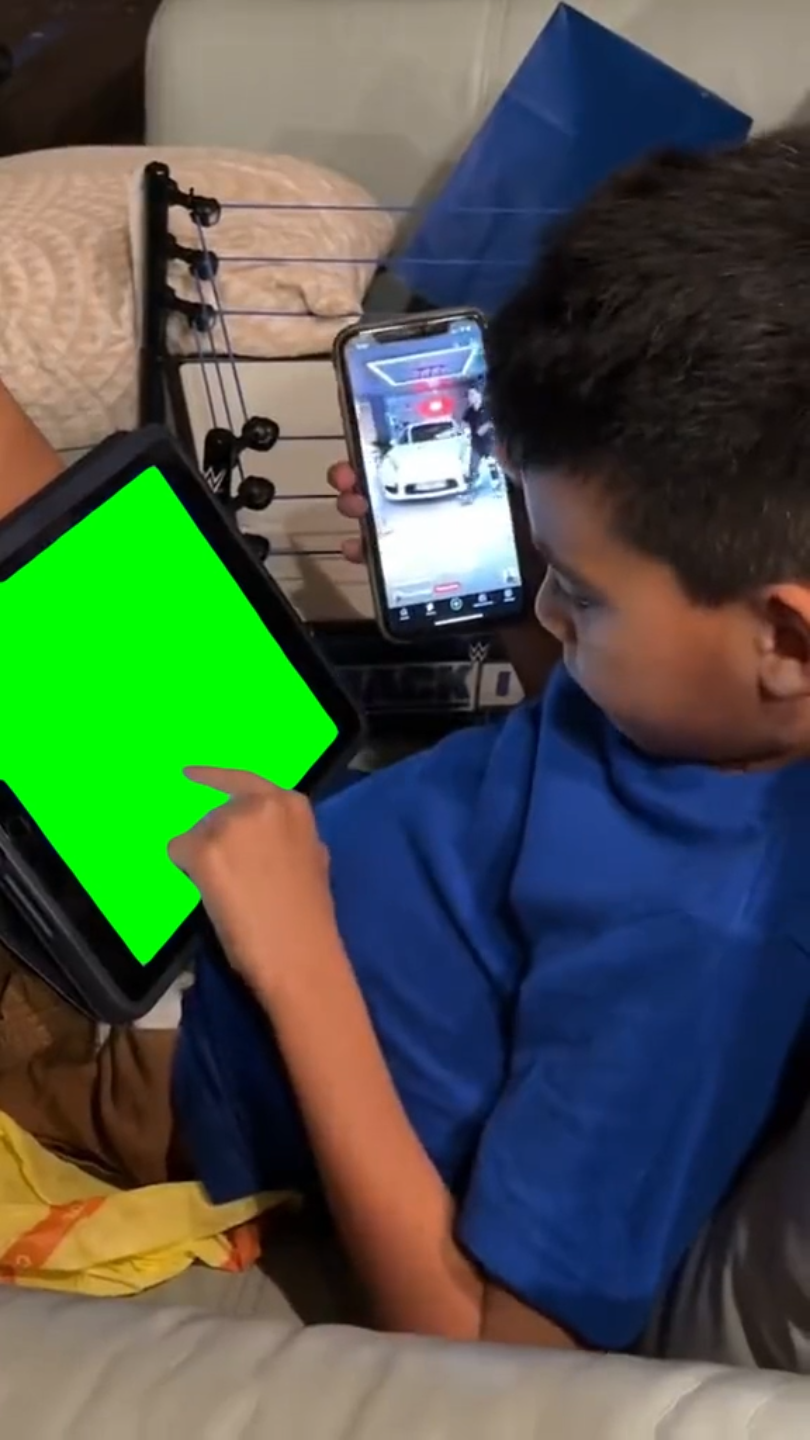 Kid using iPad and iPhone at the same time - iPad only (Green Screen)