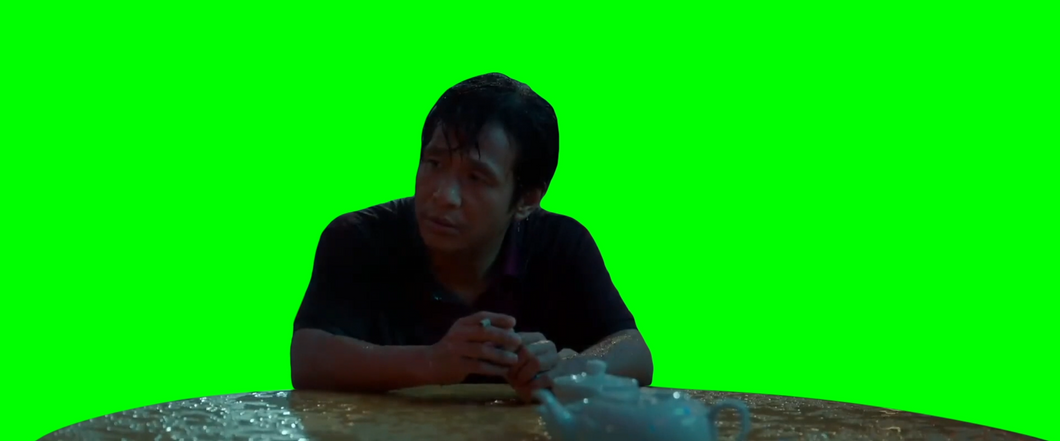 Sad man sitting at table (Green Screen)