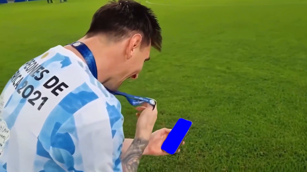Messi showing medal to phone (Green Screen)